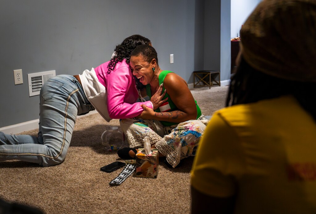 Donna Bruce jokes around with friend Melissa Bagley at Bagley's event called "Sis-mas" on December 8 where other bereaved mothers connected through their experiences.