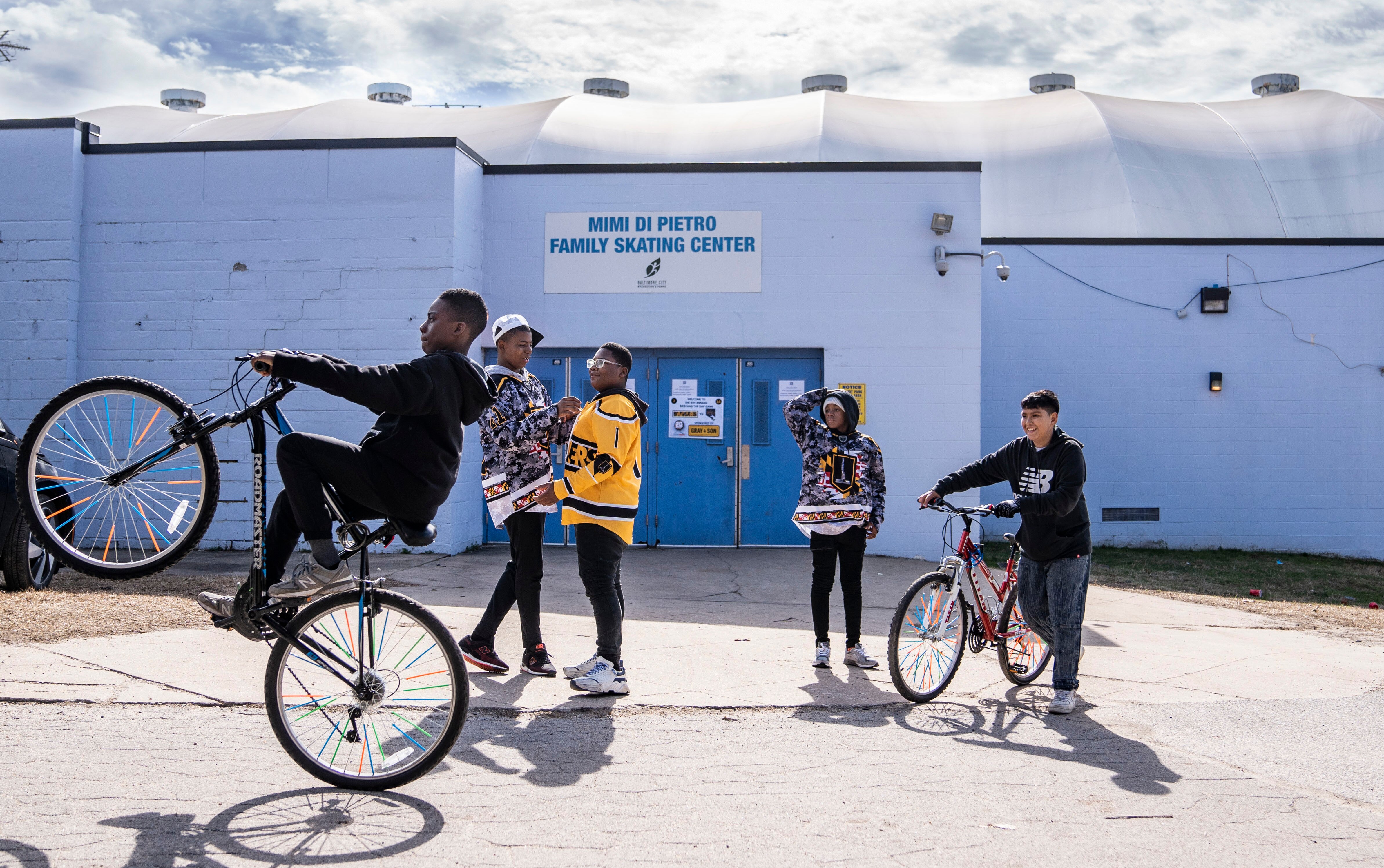 Michael Washington, Taavon Griffin, Donteze Branch, Reggie Gornish, and Yoni Portillo, all socialize outside of  Mimi DiPietro Family Skating Center after a game, in Baltimore, February 19, 2023.