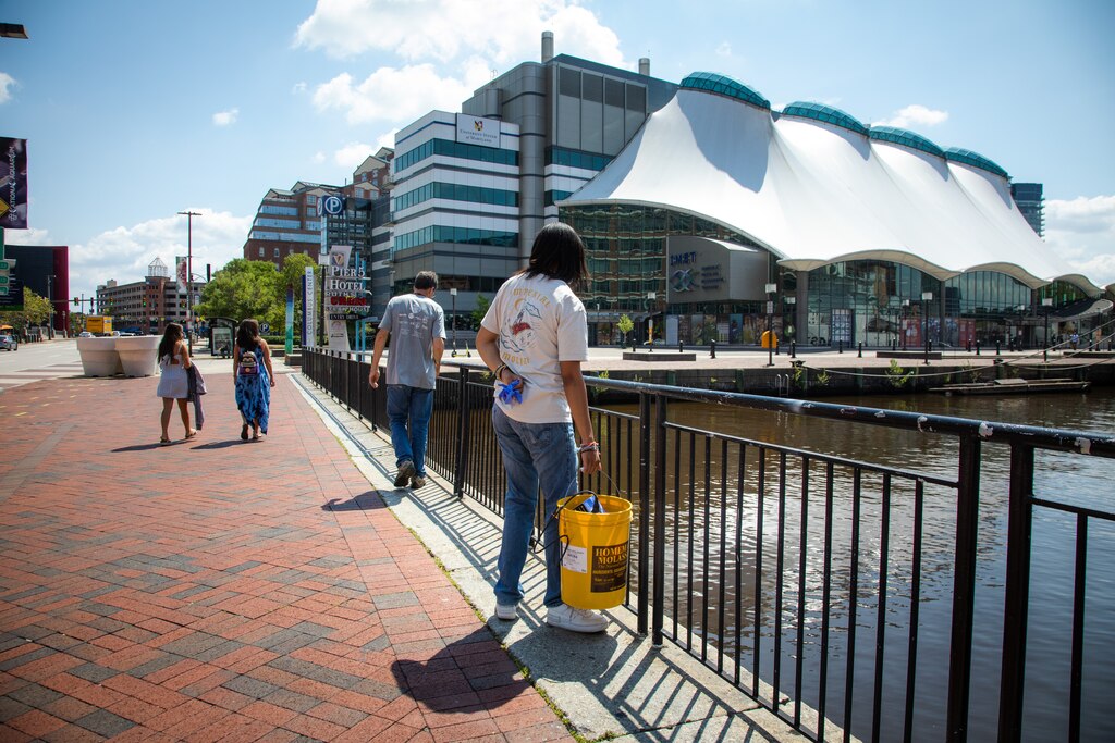 Makayla Stewart and Eric Schott examining a potential mahogany tide outside the Institute of Marine and Environmental Technology (IMET).