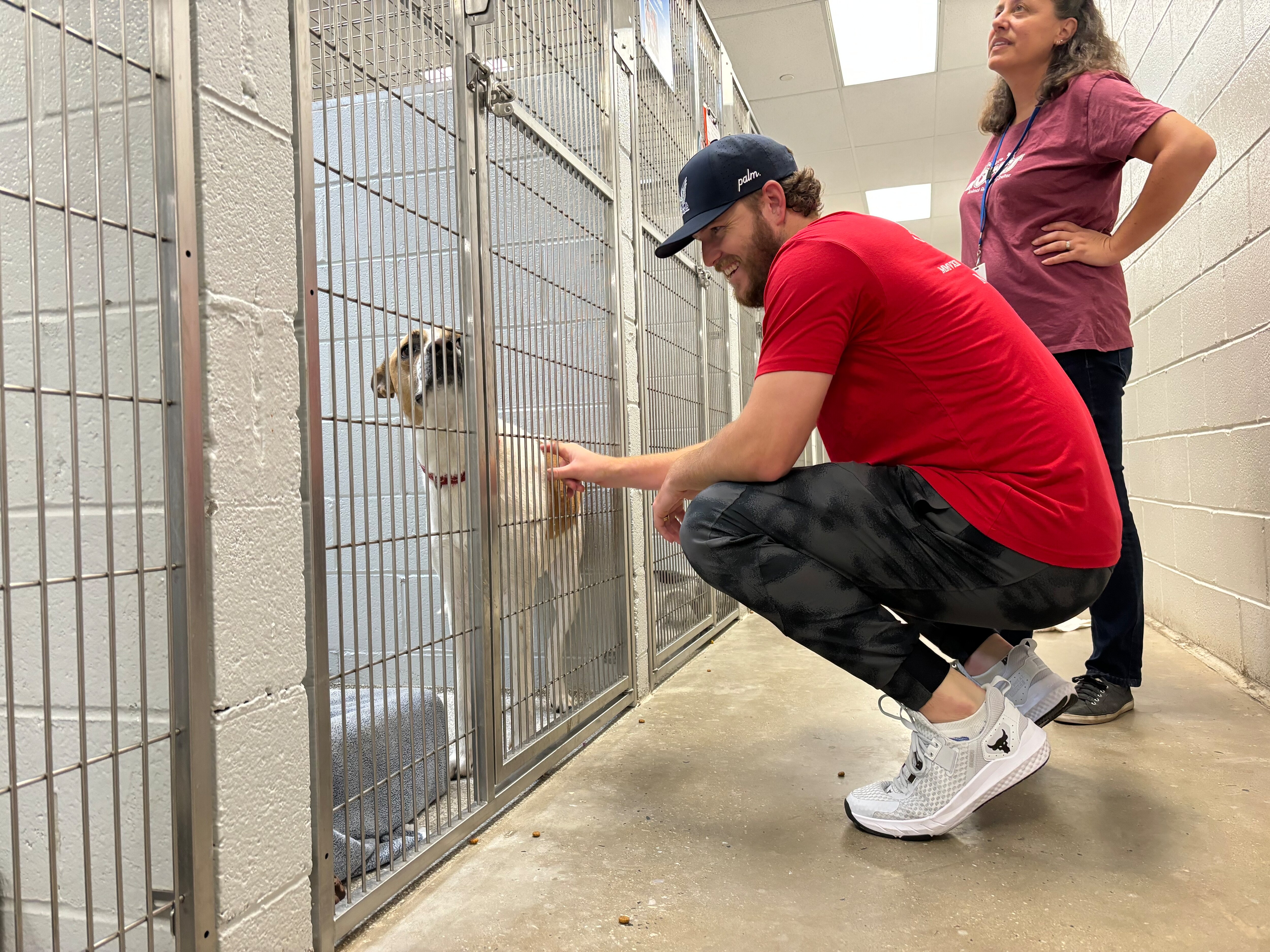 Orioles pitcher Cole Irvin visits the Baltimore Animal Rescue and Care Shelter. The center recently took in 83 dogs and one cat seized from a Northwest Baltimore home.