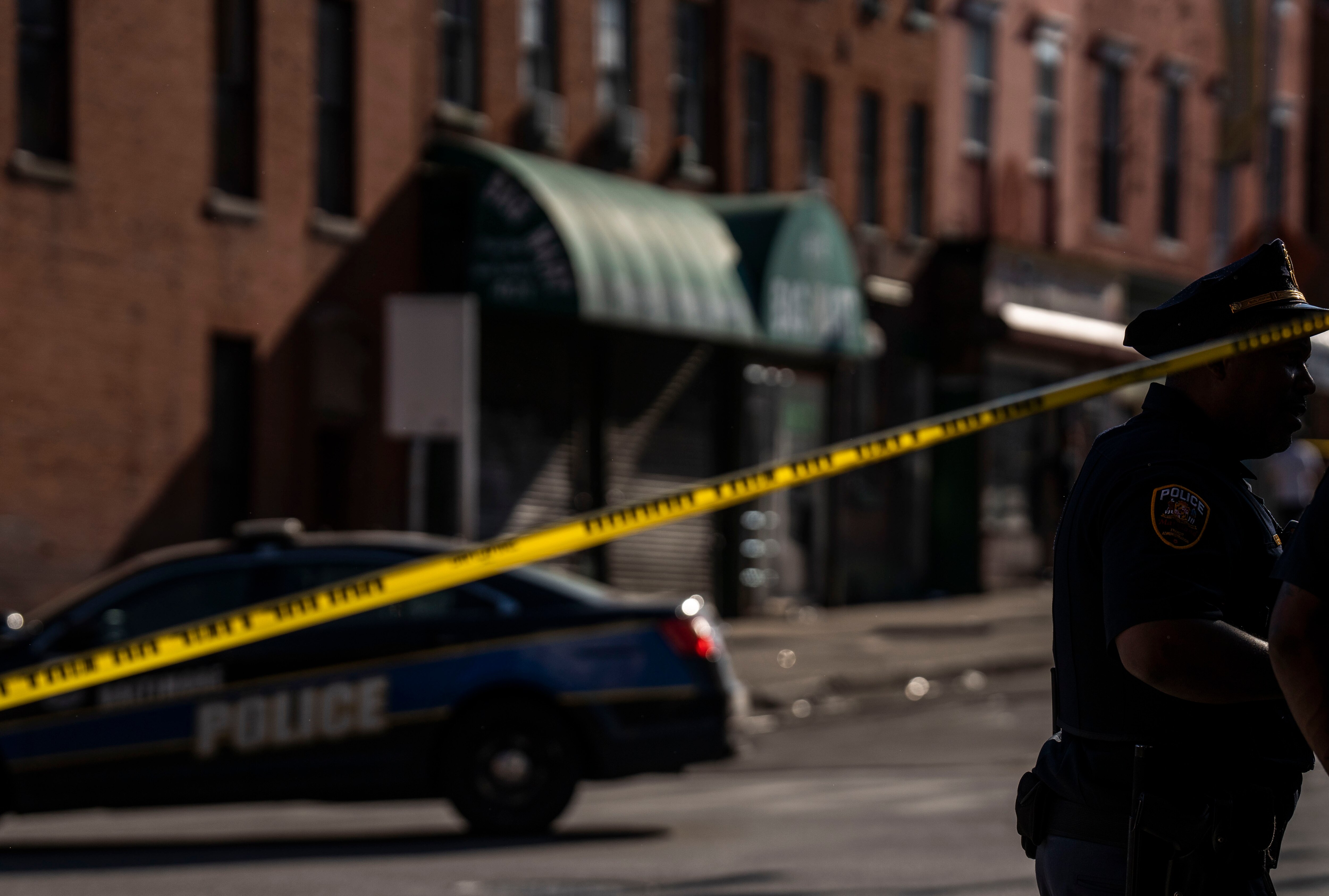 Police respond to a shooting near the intersection of North Eutaw and West Saratoga streets on Friday, May 26.