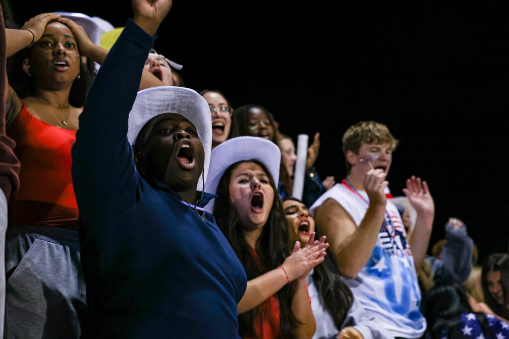 Poolesville High School students cheer during a football game on Friday, October 24, 2025 in Poolesville, MD.