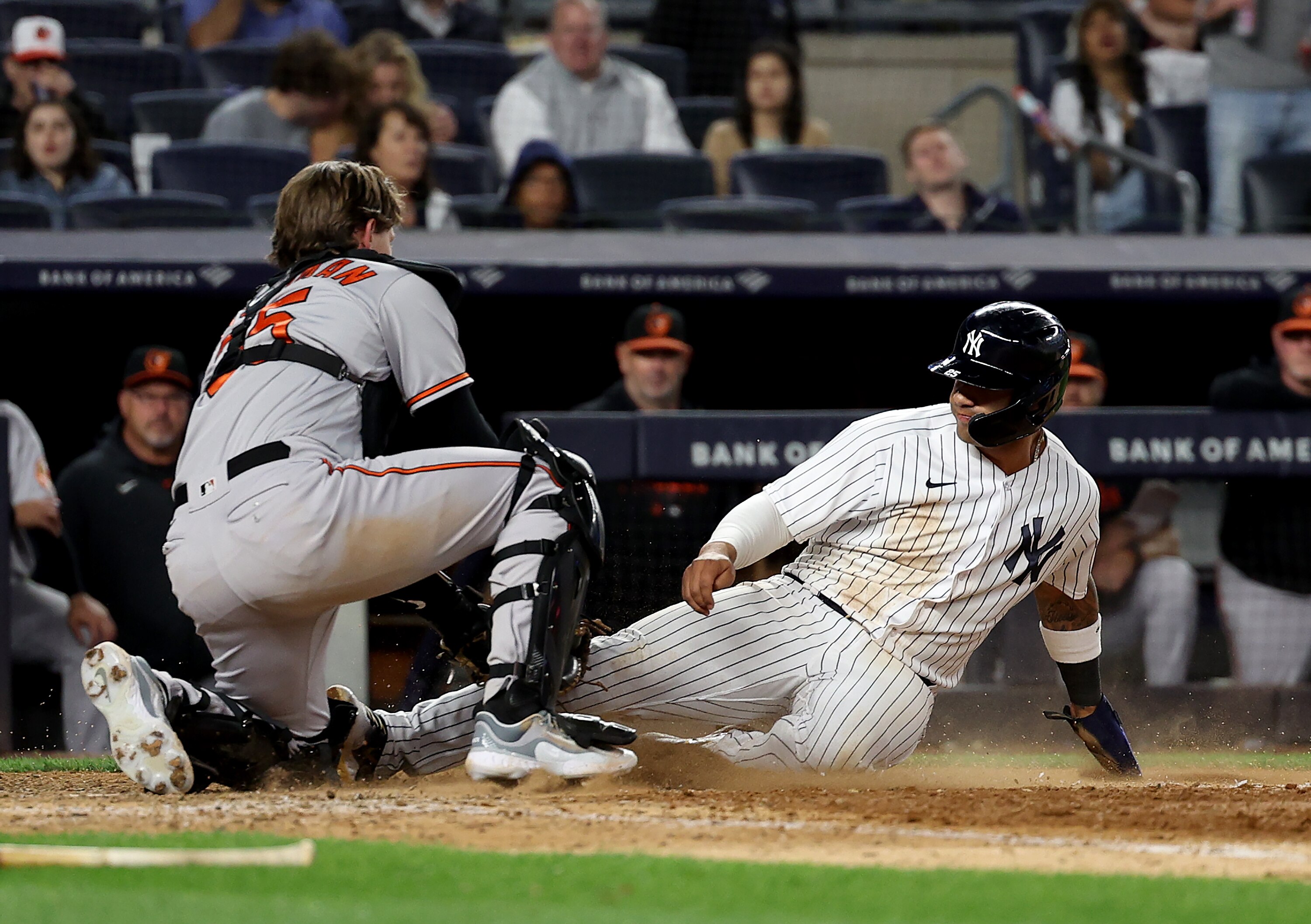 Gleyber Torres #25 of the New York Yankees is out at home as Adley Rutschman #35 of the Baltimore Orioles makes the tag in the seventh inning at Yankee Stadium on May 23, 2023 in Bronx borough of New York City.