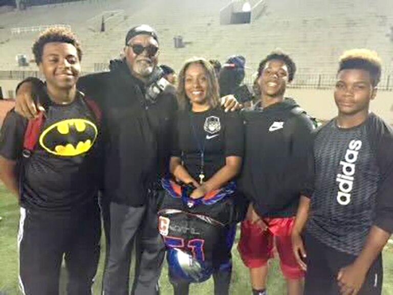 Kandice Mitchell, center, with her sons Kobi and Keaton, her nephew Kevin, and her father, Augustus Pritchett.