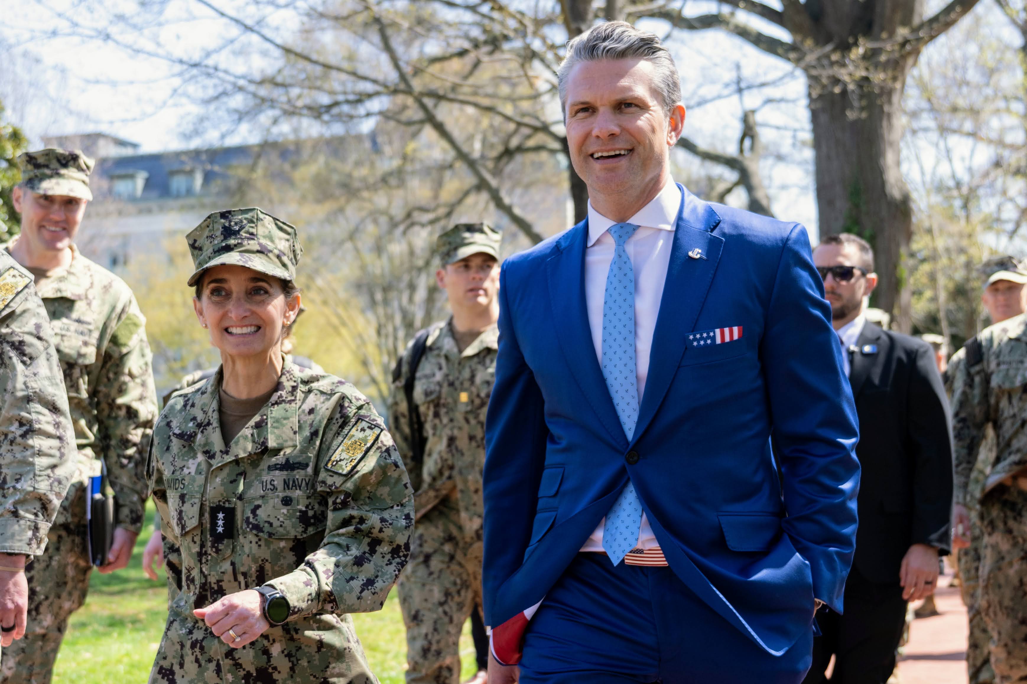 Secretary of Defense Pete Hegseth walks alongside Vice Adm. Yvette Davids, academy superintendent, during his visit to the U.S. Naval Academy on April 1, 2025.