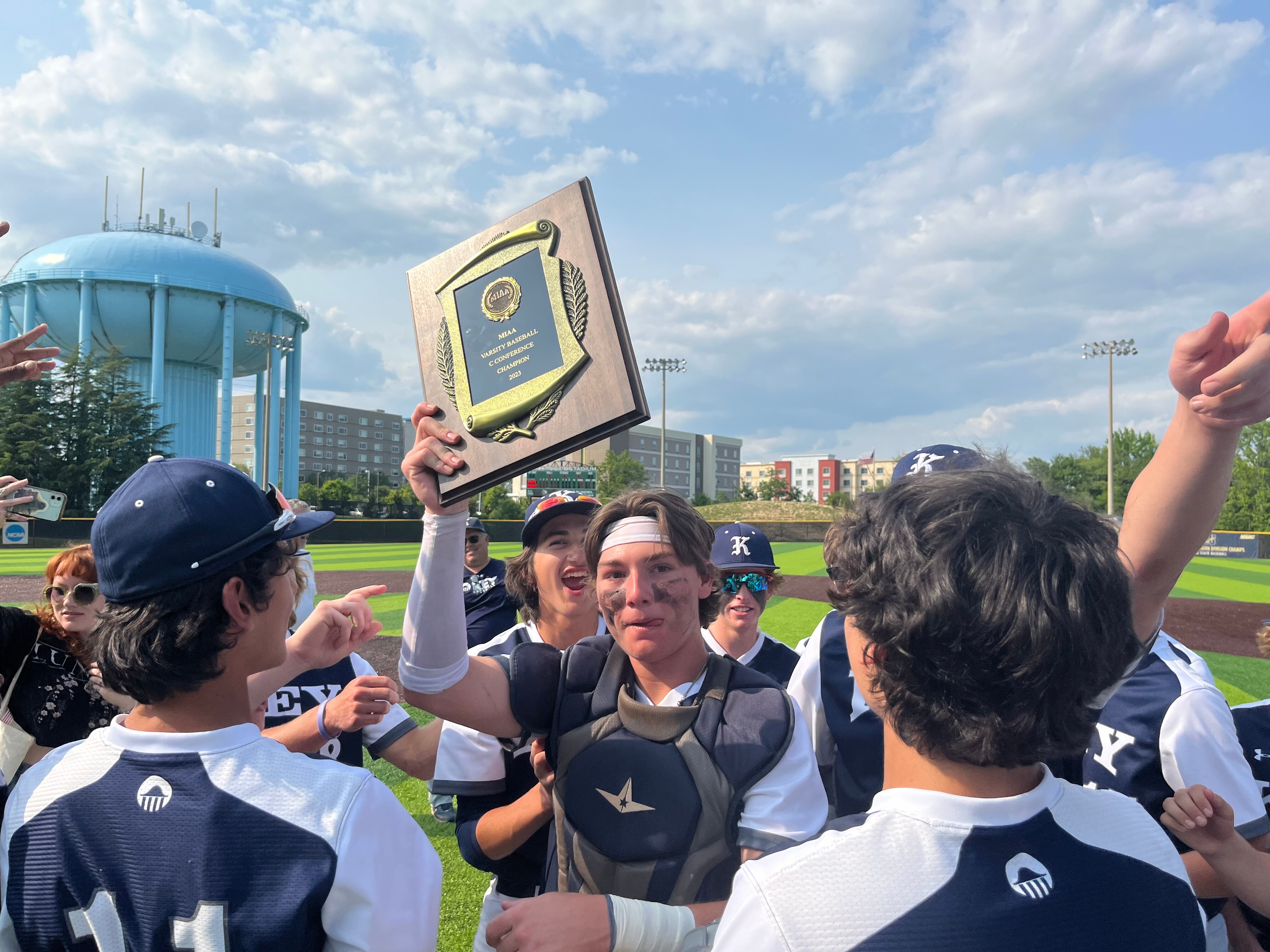 Key catcher and co-captain Colin MacNabb holds up the MIAA C Conference baseball championship plaque Monday. The Obezags won their second straight title with a 13-2 victory over Concordia Prep at Joe Cannon Stadium in Anne Arundel County.