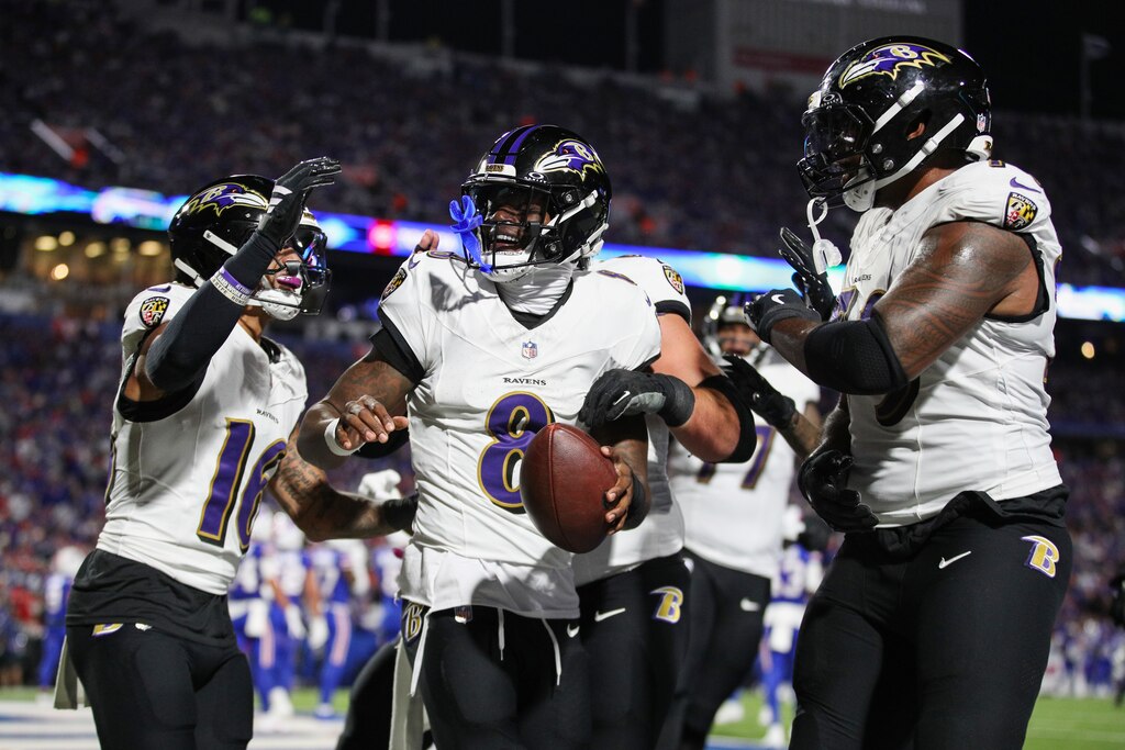 ORCHARD PARK, NEW YORK - SEPTEMBER 07: Lamar Jackson #8 of the Baltimore Ravens celebrates after scoring a touchdown during the second quarter against the Buffalo Bills at Highmark Stadium on September 07, 2025 in Orchard Park, New York.