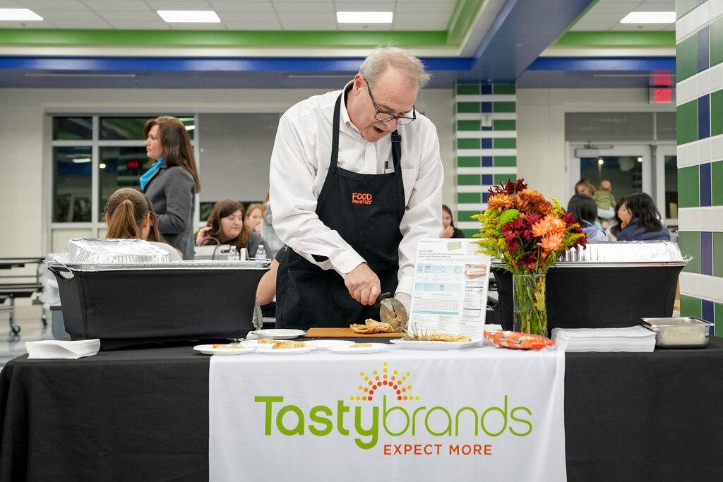 John Brewer prepares the Buffalo-style chicken breast & mozzarella flat breads for a taste test of the Howard County Public School System’s school lunch menu at the Guilford Park High School cafeteria in Jessup, Md. on Thursday, November 14, 2024. It was the first time HCPSS Food and Nutrition services has hosted the event, and was open to students, staff and families in the community.