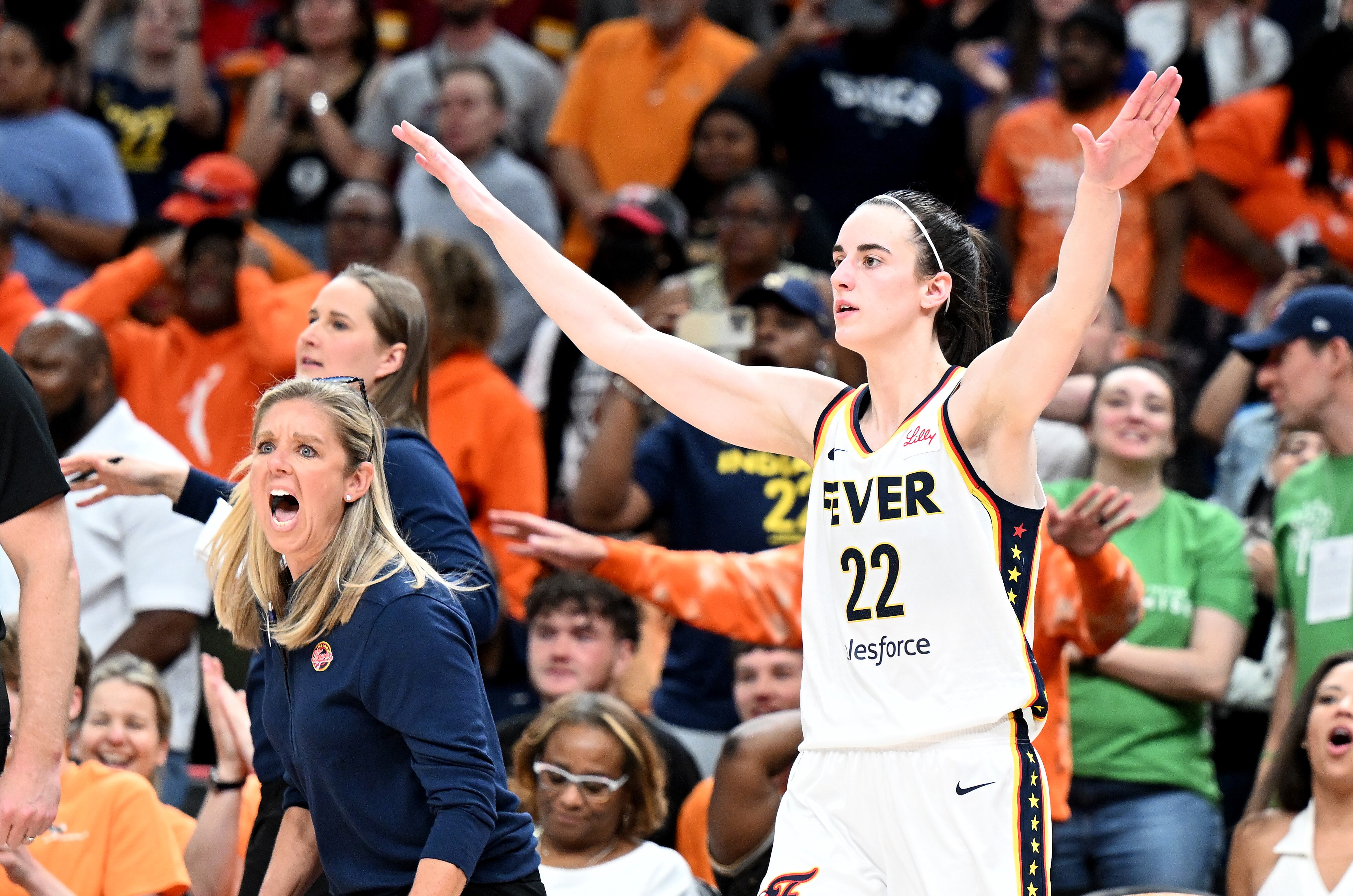 Head coach Christie Sides and Caitlin Clark of the Indiana Fever celebrate after an 85-83 victory against the Washington Mystics on June 7, 2024.