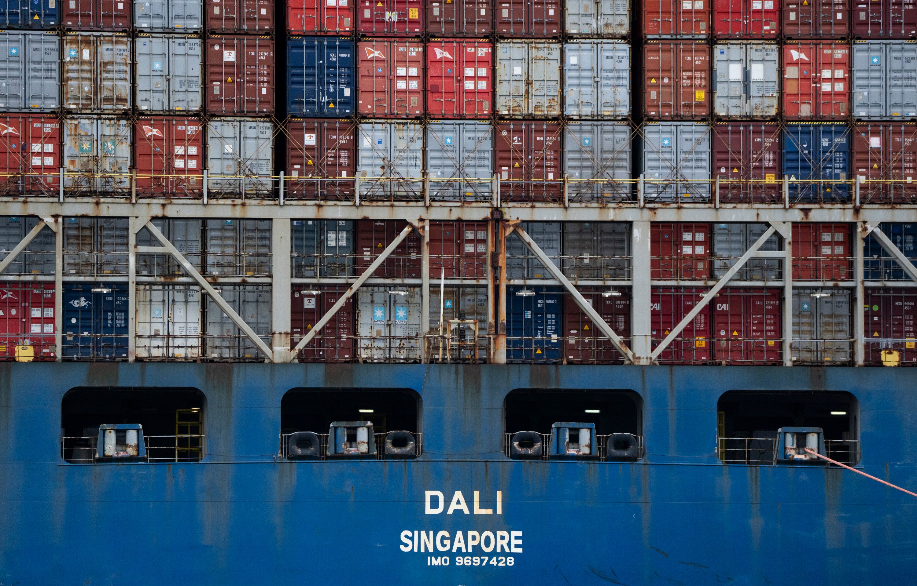 The Dali, a massive container ship from Singapore,  still sits in the wreckage and collapse of the Francis Scott Key Bridge in the Baltimore port on April 1, 2024. It has been a week since it lost power and struck the bridge , causing it to topple in seconds, taking several roadway workers and their cars with it. The once giant frame of the bridge now sits in the water and large cranes have arrived to untangle the mess.