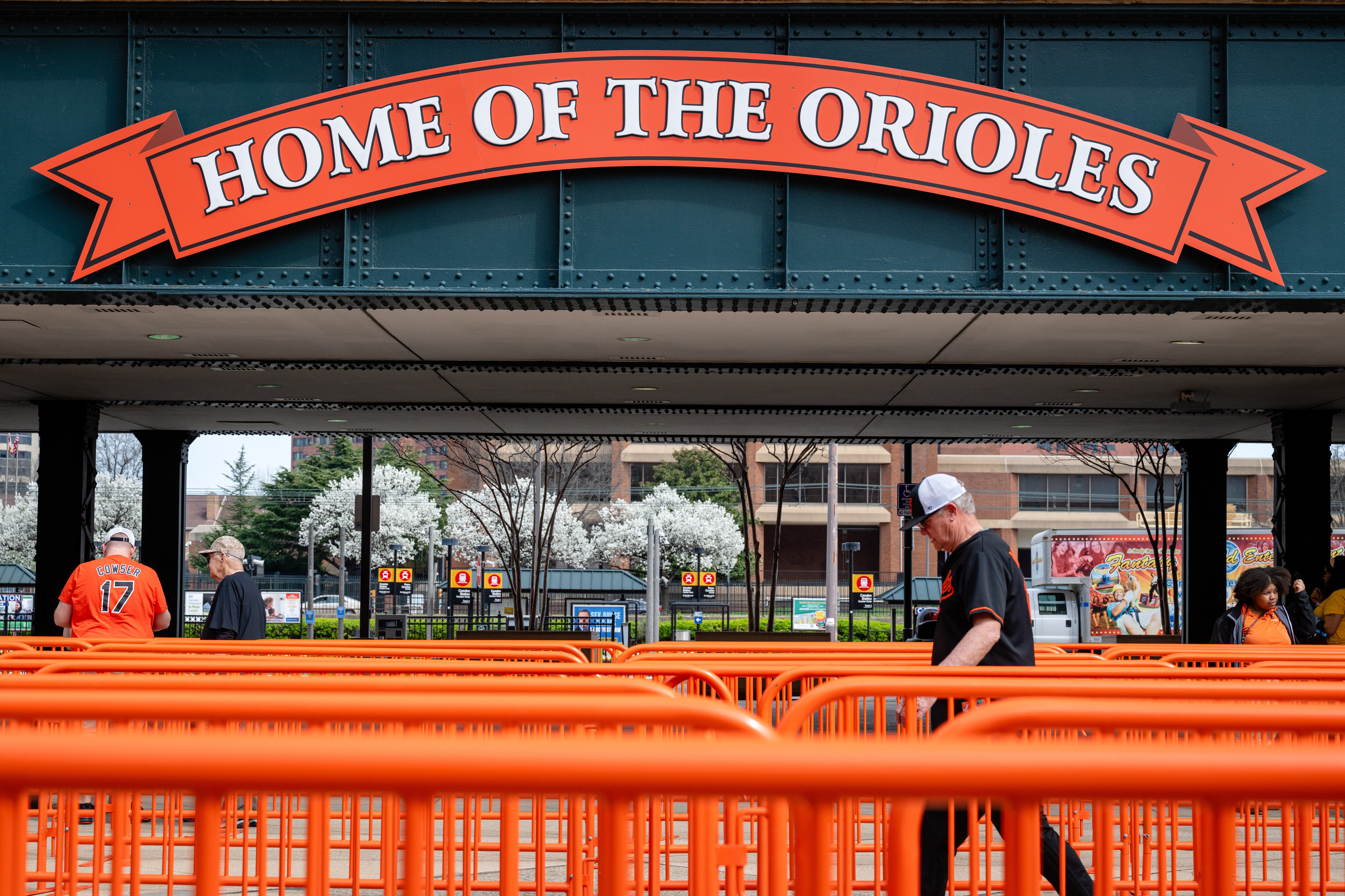 A fan walks through the entry gates at Camden Yards during the Orioles’ Eutaw Street Block Party on Saturday.