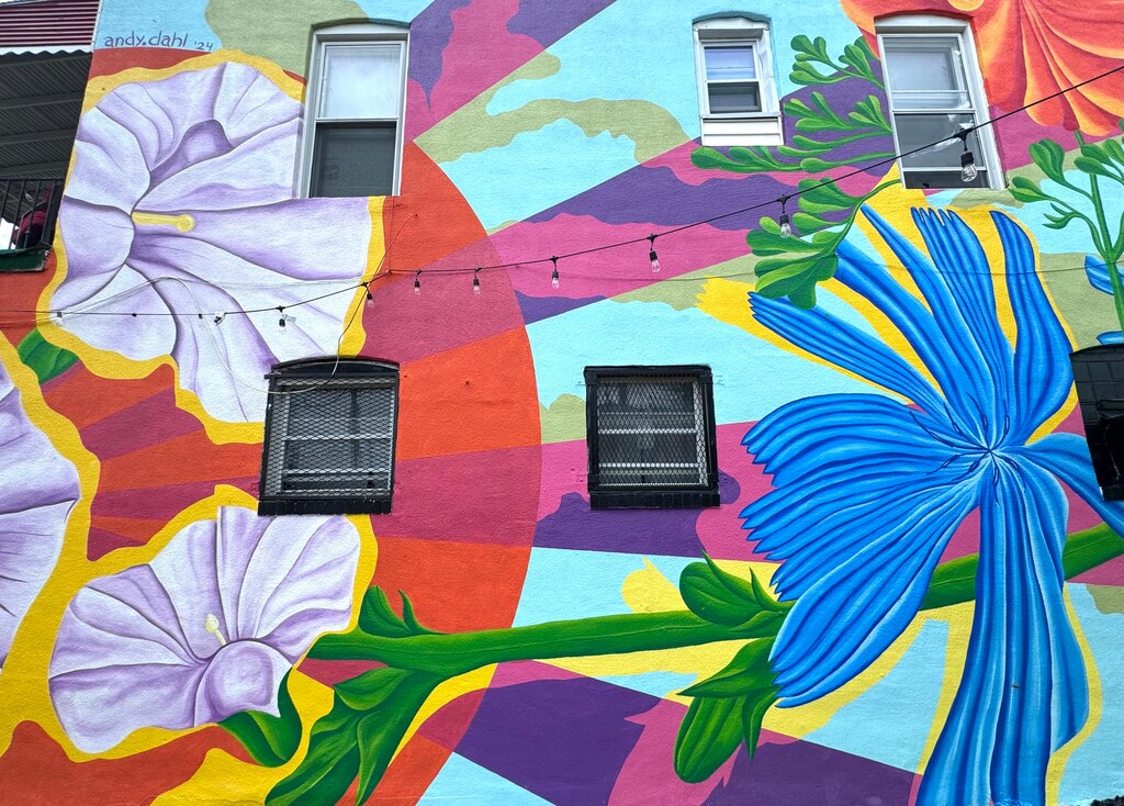 A mural by local artist Andy Dahl on the home of Charles Foster was shown to the public for the first time on July 18, 2024. The mural took Dahl about a month to finish.