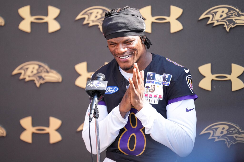Baltimore Ravens quarterback Lamar Jackson (8) takes questions from reporters following the team’s training camp session at the Under Armour Performance Center in Owings Mills, Md. on Wednesday, July 13, 2025.