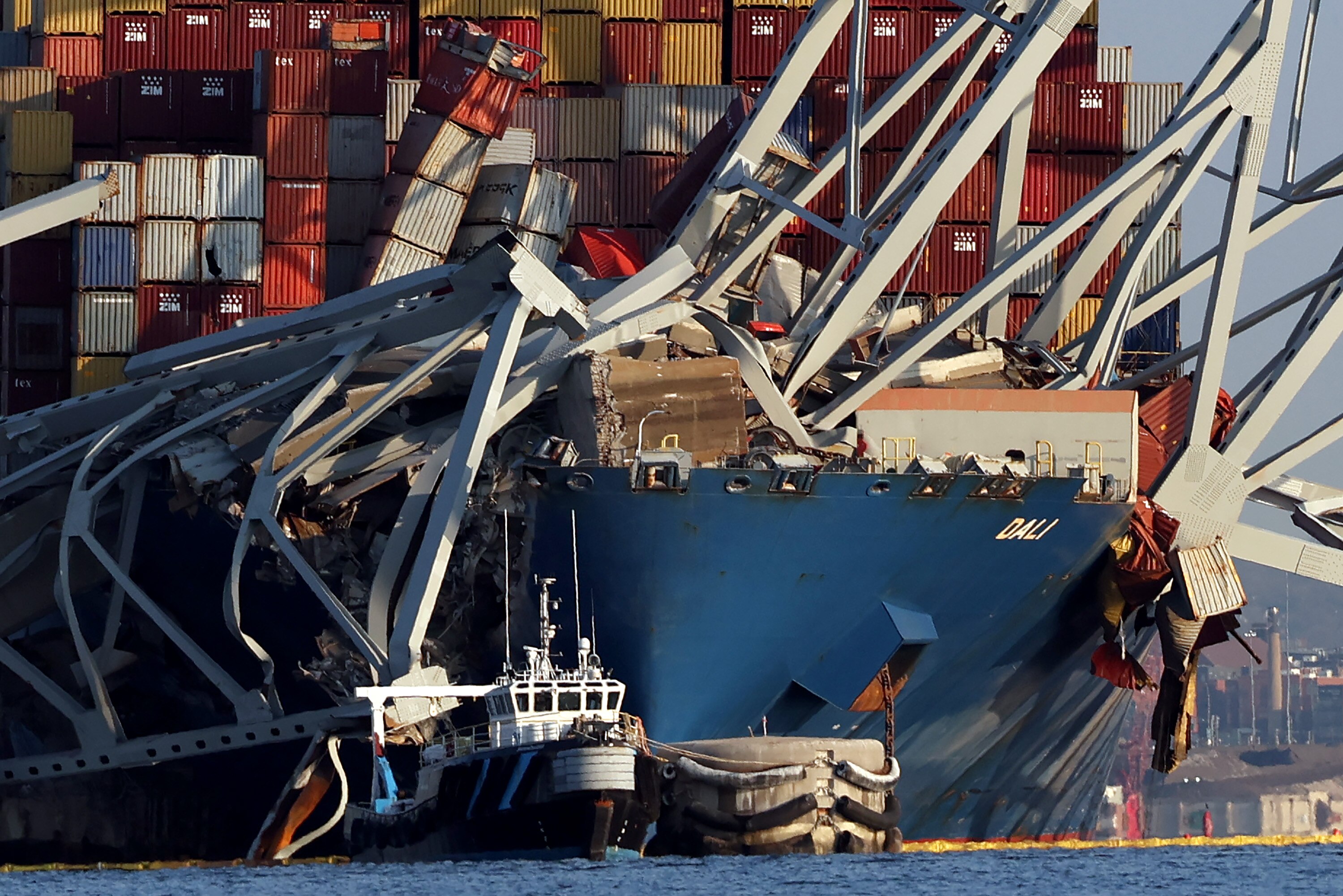 Crushed shipping containers are seen on the bow of the Dali after it struck the Francis Scott Key Bridge in Baltimore. Grace Ocean Private, the owner of the Dali, and Synergy Marine Group, the manager of the ship, on Monday filed a petition for exoneration from or limitation of liability in U.S. District Court in Baltimore.