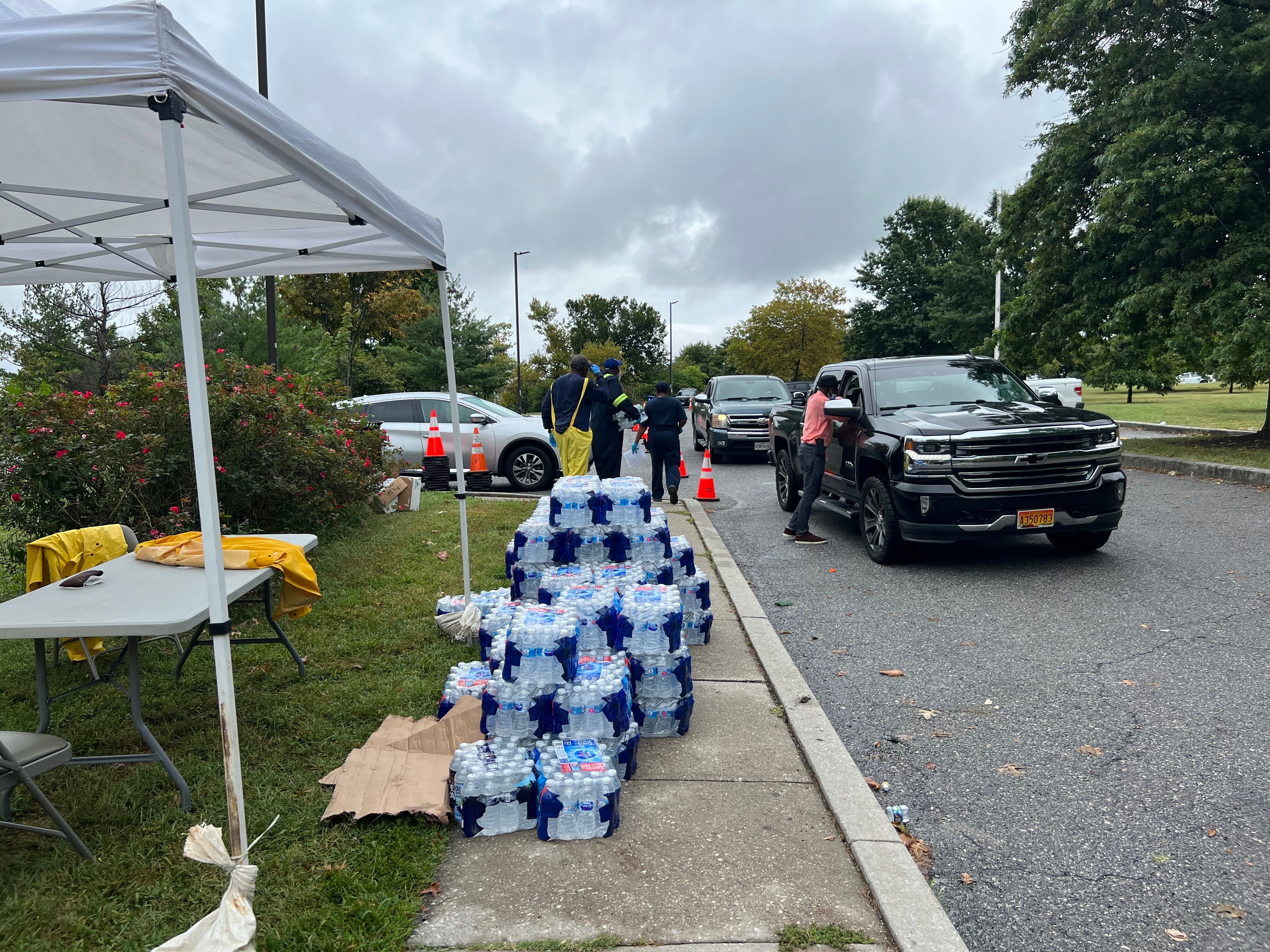 Workers distribute water at 3301 Waterview in response to E. coli contamination in Baltimore City water.