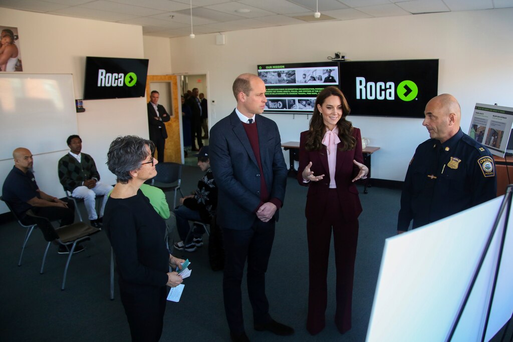 Britain's Prince William and Kate, Princess of Wales tour Roca with founder Molly Baldwin, left, and Chelsea police captain Dave Batchelor Thursday, Dec. 1, 2022, in Chelsea, Mass.
