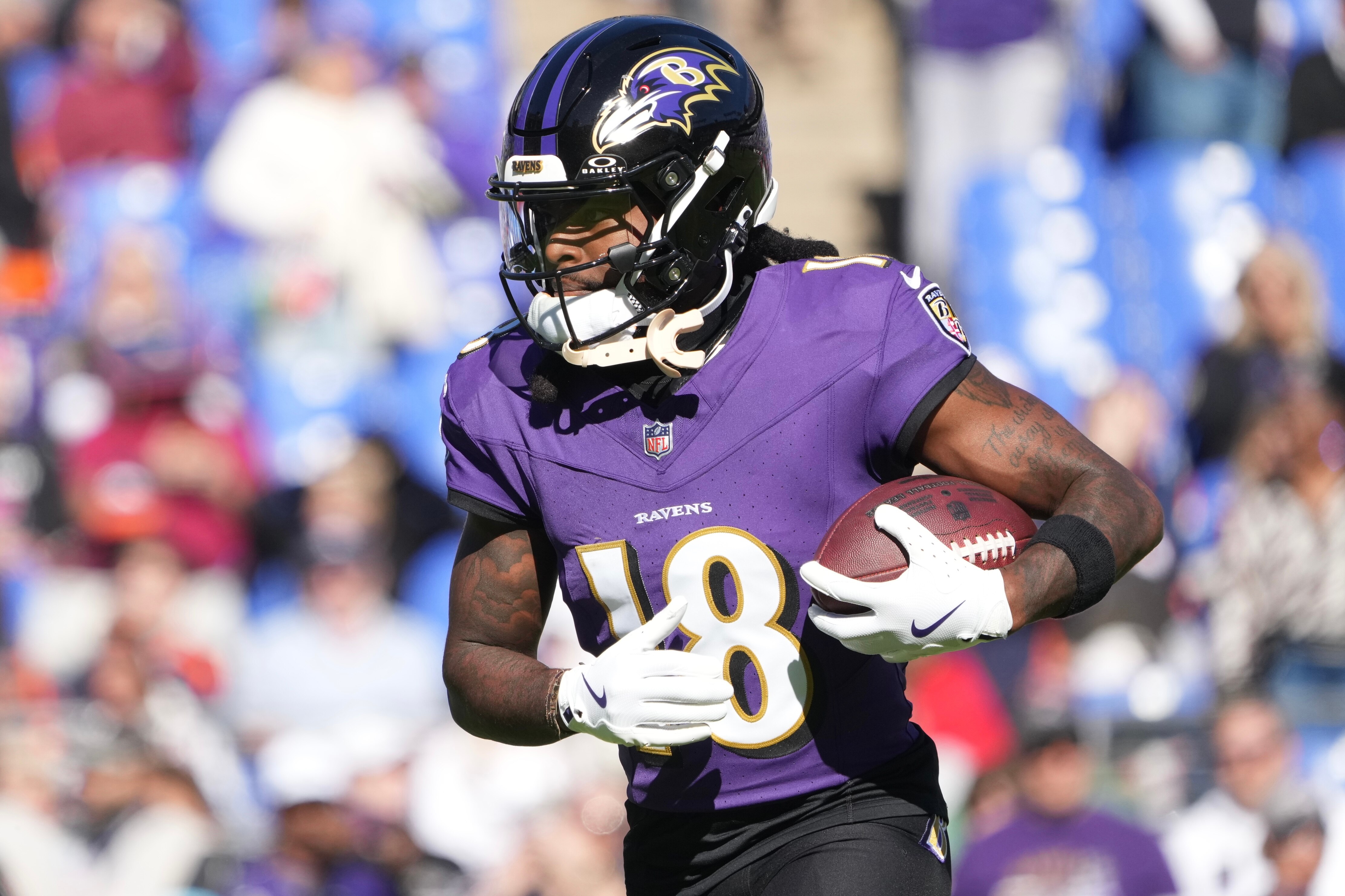 Baltimore Ravens wide receiver Diontae Johnson (18) catches a pass while warming up before a regular season game against the Denver Broncos at M&T Bank Stadium on Sunday, November 3, 2024.