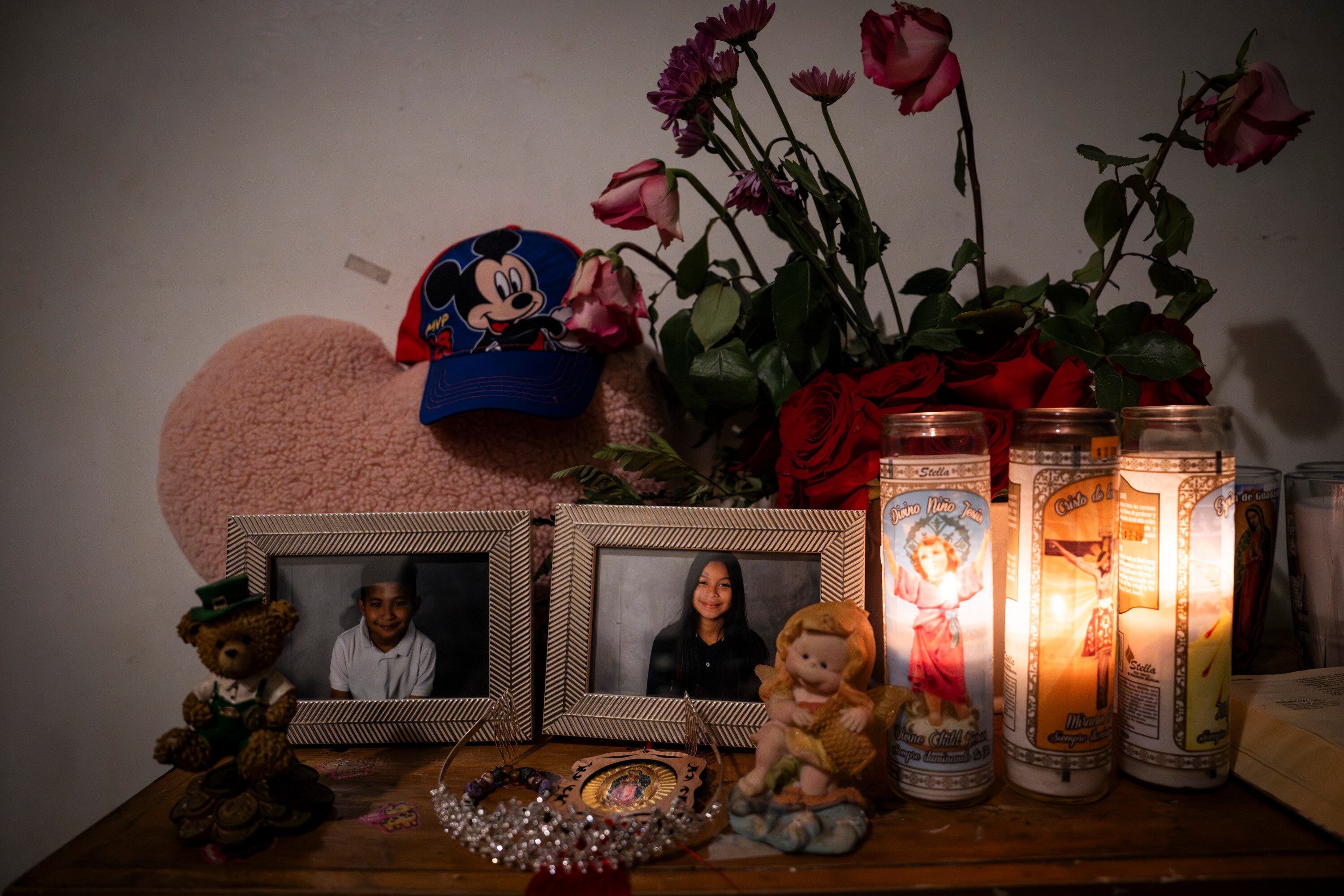 An altar is set up with photos of Angel Gustavo Adolfo Paz Gutierrez, 8, Yeymi Rubi Gutierrez Paz, 13, and their cousin Jeremías Gutierrez Gomez, 22. They all died in a house fire in the early morning of Feb. 27.