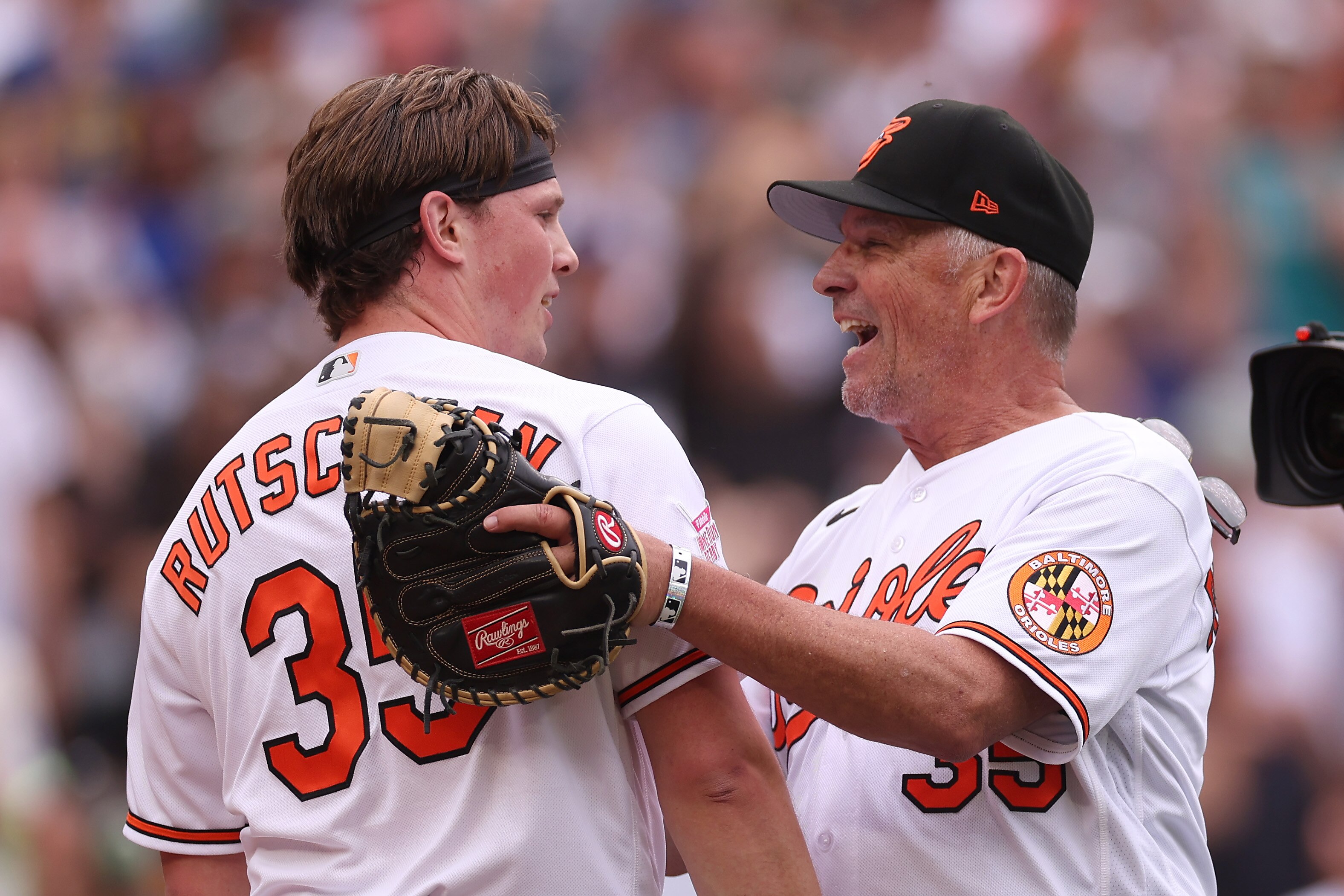 Adley Rutschman, #35 of the Baltimore Orioles, hugs his father Randy after batting during the T-Mobile Home Run Derby at T-Mobile Park on July 10, 2023.