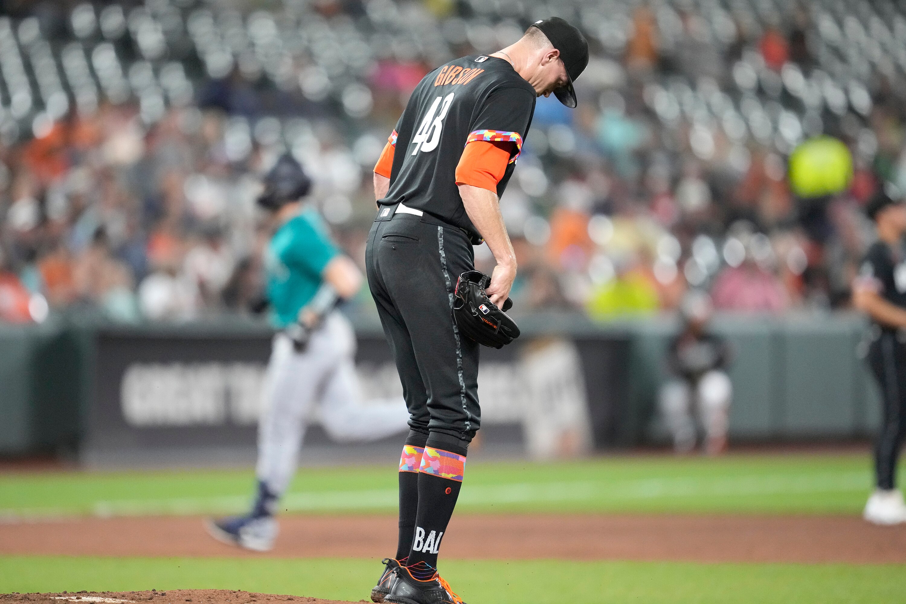 Kyle Gibson #48 of the Baltimore Orioles looks on after giving up a two-run home run to Tom Murphy #2 of the Seattle Mariners in the third inning at Oriole Park at Camden Yards on June 23, 2023 in Baltimore, Maryland.