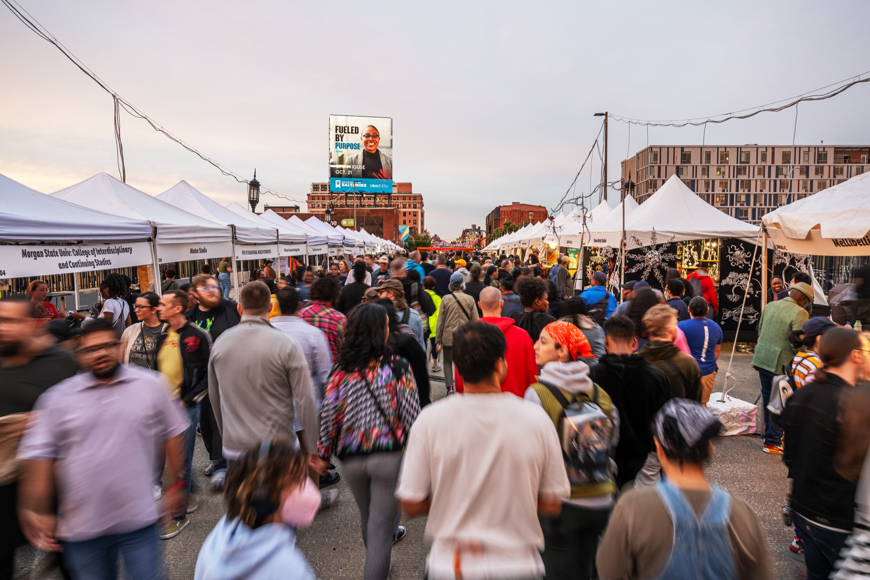 Attendees congregate along Charles Street at Artscape in Baltimore, MD on September 22, 2023. (Photo by Craig Hudson for The Baltimore Banner)