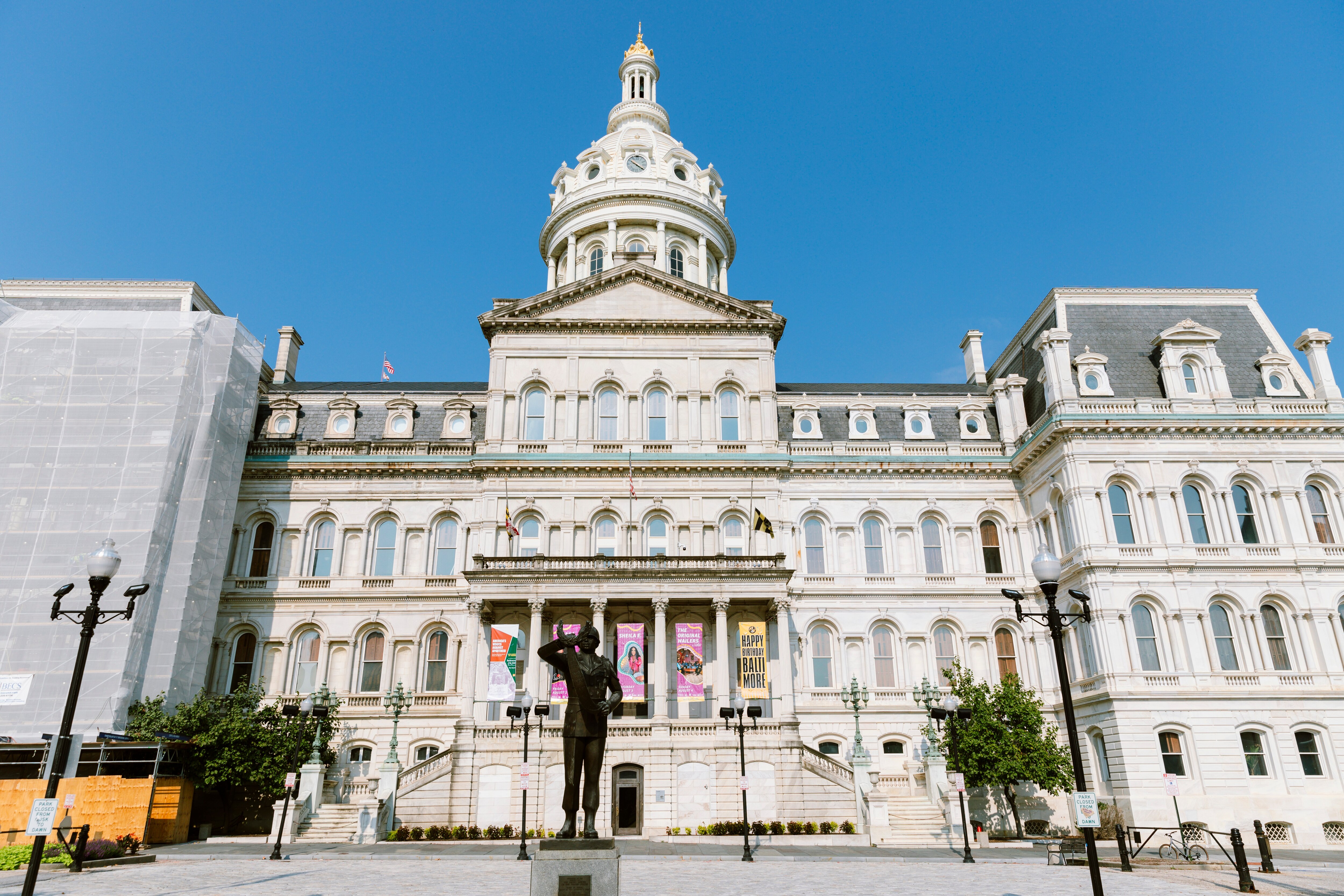 Baltimore officials trimmed nearly $6 million from income tax projections Wednesday — and may have to trim more later, depending on federal job cuts.