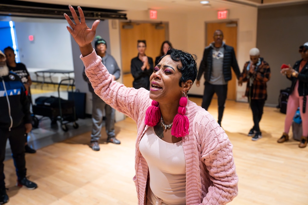 Donna Bruce leads a prayer circle before the day begins at the Bereaved Mother's Fashion show on November 18 , 2023.